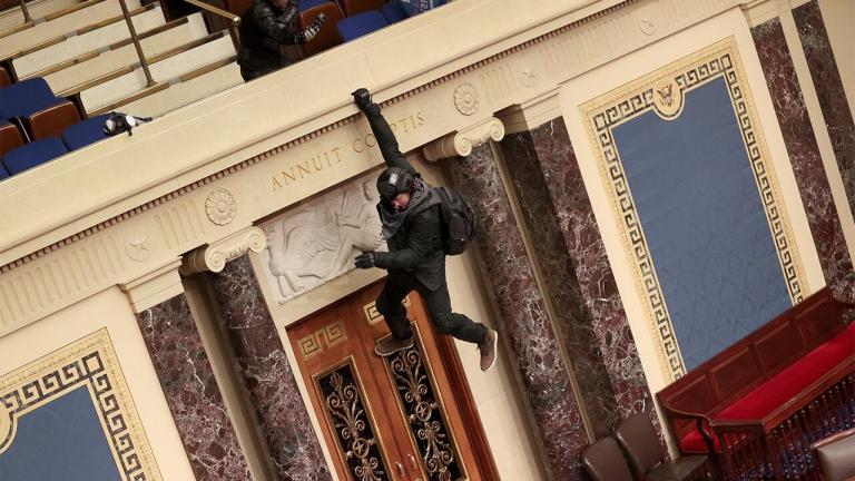 Capitol Hill rioter seen climbing down Senate balcony apologizes again