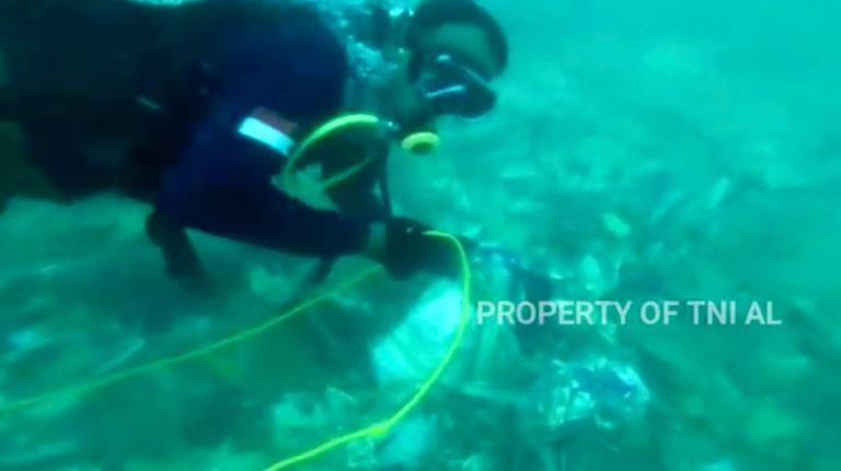 Indonesia navy divers hunt for crashed plane’s black boxes