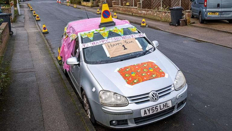 Neighbors throw birthday party for abandoned car that’s been left on street for a year