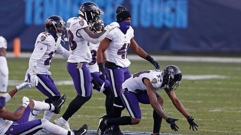 Ravens return favor to Titans by celebrating, stomping on logo during wild-card victory