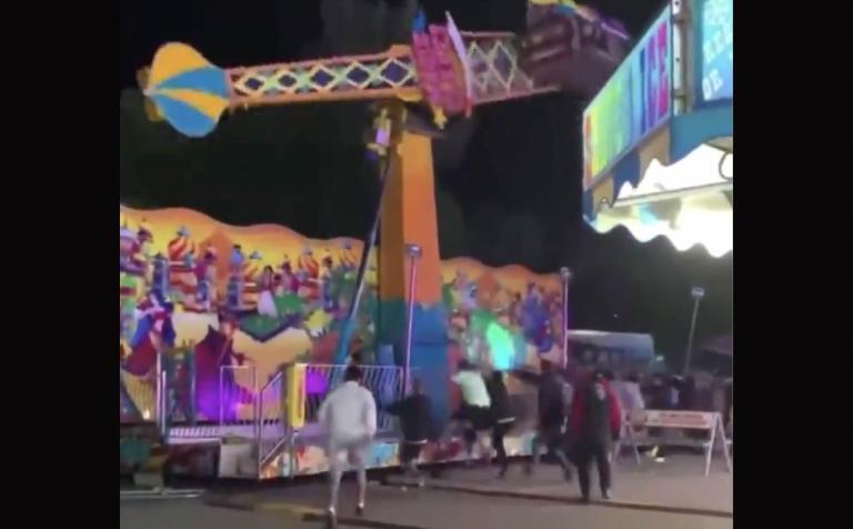 [VIDEO] Bystanders at MI Festival Rush Over to Prevent a Carnival Ride From Tipping Over