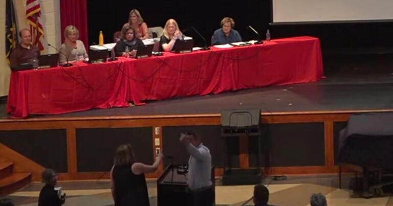 Watch: After Describing Homeland ‘Ravaged by Communism,’ School Board Compels Police to Remove Woman