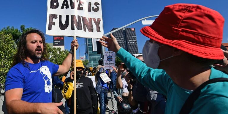 Netflix protesters furious over Chapelle special attack man with ‘We like Dave’ sign